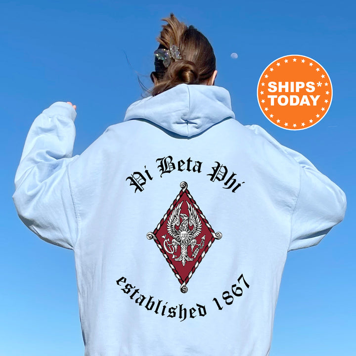 a woman wearing a white hoodie with a picture of a cross on it