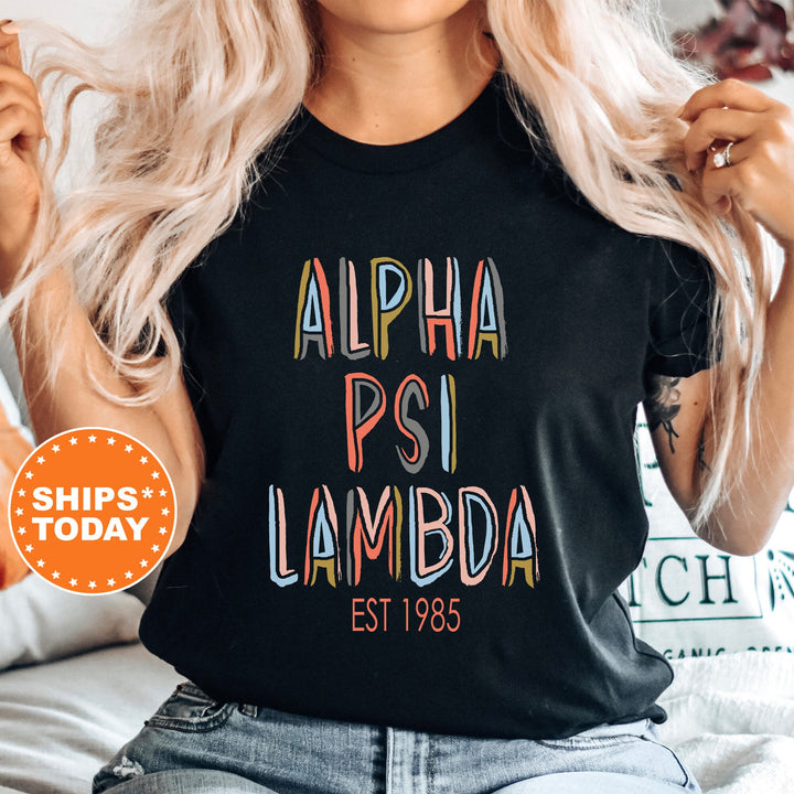 Alpha Psi Lambda Pastel Stencil Coed T-Shirt | Alpha Psi Lambda Comfort Colors Shirt | Frat Bid Day Gift | Custom Greek Apparel _ 8833g