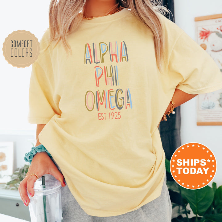 Alpha Phi Omega Pastel Stencil Coed T-Shirt | APHIO Comfort Colors Shirt | Fraternity Apparel | Bid Day Gift | Custom Greek Apparel _ 8832g