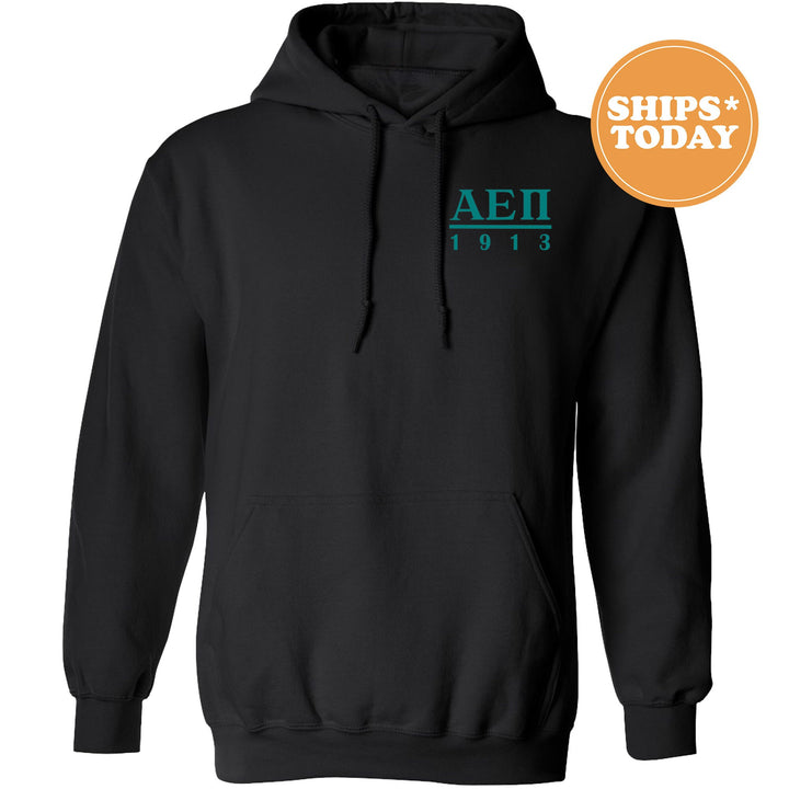 a black hoodie with the aei logo on it