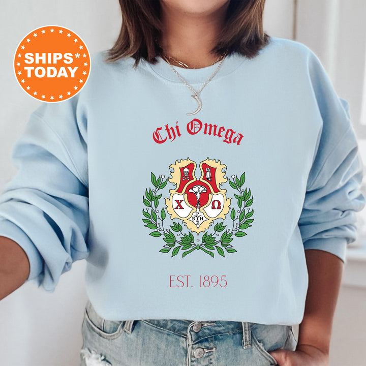 a woman wearing a blue sweatshirt with a crest on it