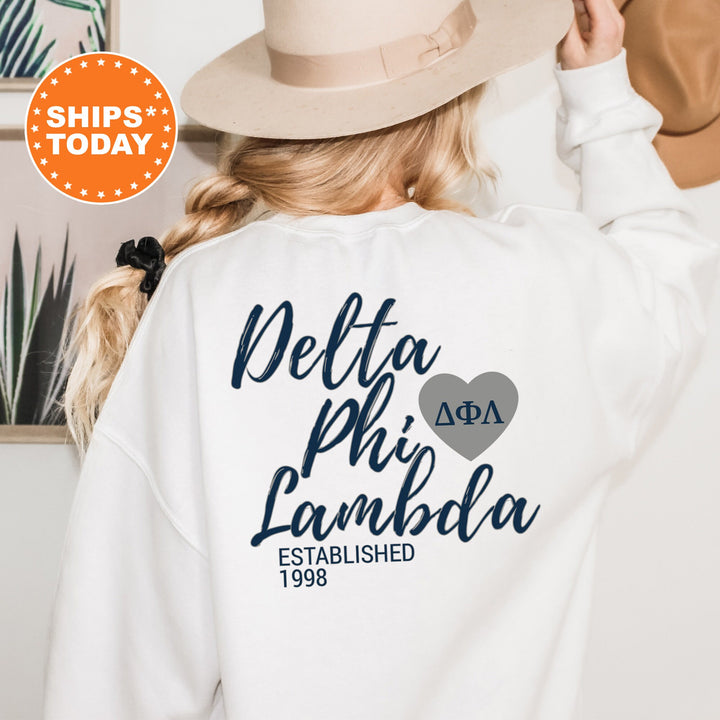 a woman wearing a white sweatshirt and a hat