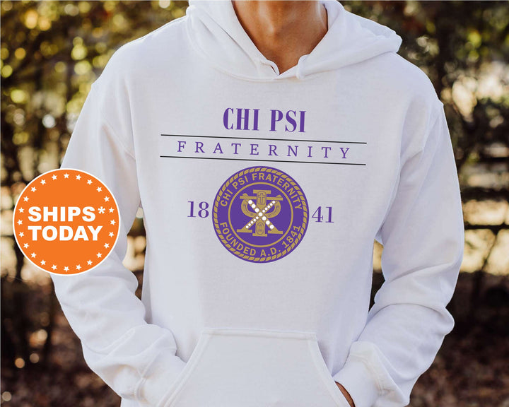 a person wearing a white hoodie with a purple and gold design