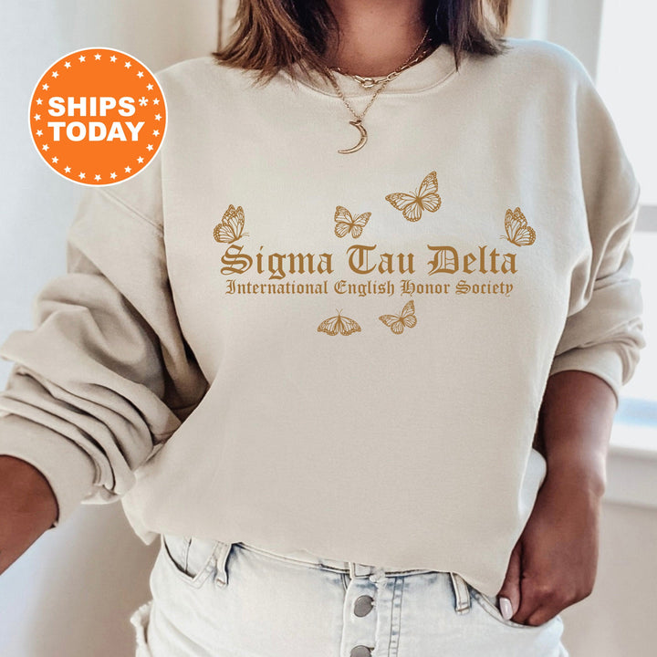 a woman wearing a sweatshirt with a butterfly print