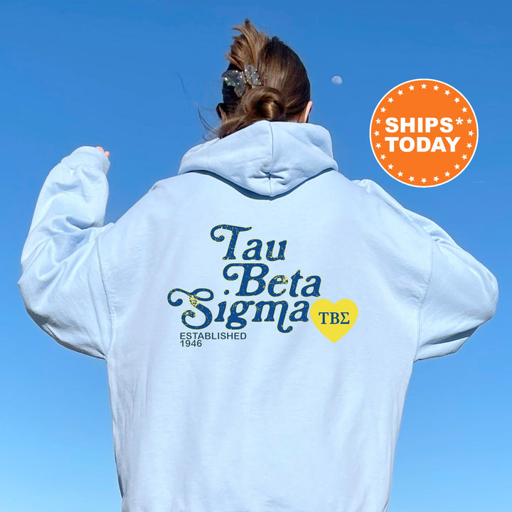 a woman wearing a white hoodie with a blue sky in the background