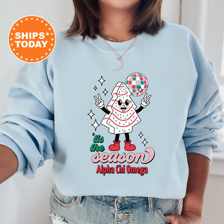 a woman wearing a blue sweatshirt with an image of a cartoon character