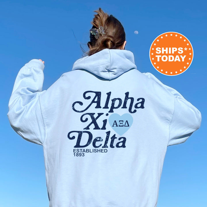 a woman with her back to the camera wearing a white hoodie