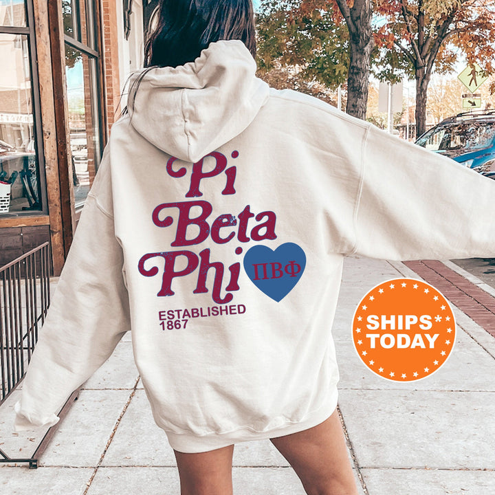 a woman walking down a sidewalk wearing a white hoodie