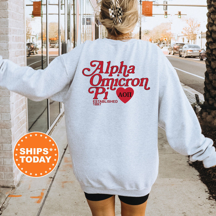 a woman walking down a sidewalk wearing a white sweatshirt