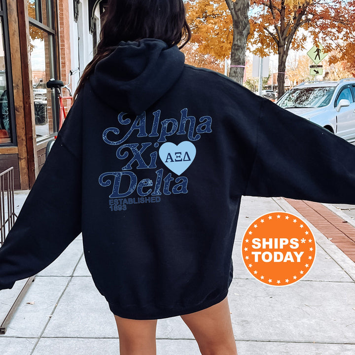 a woman in a black hoodie is walking down the street