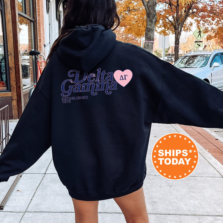 a woman in a black hoodie is walking down the street