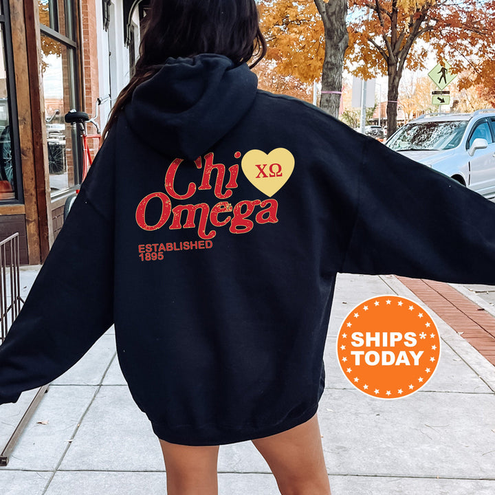 a woman in a black hoodie is walking down the street