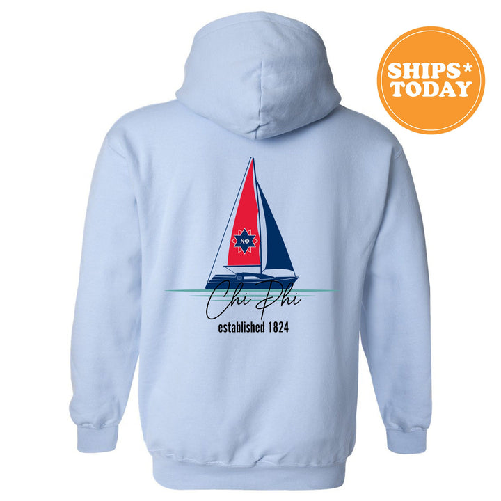 a blue hoodie with a sailboat on it
