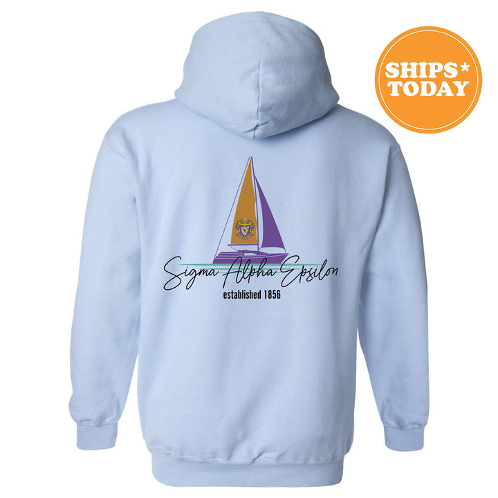 a blue hoodie with a sailboat on it