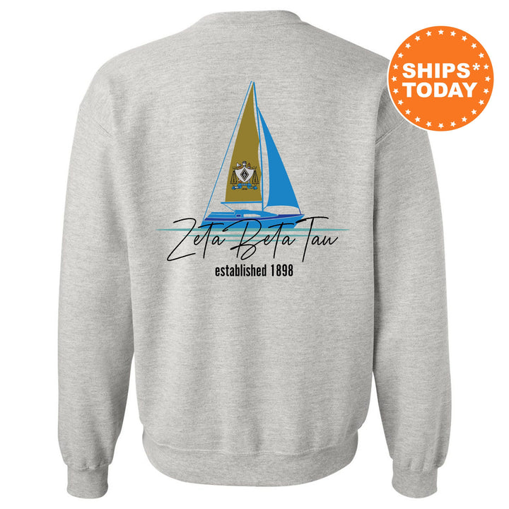 a sweatshirt with a sail boat on it