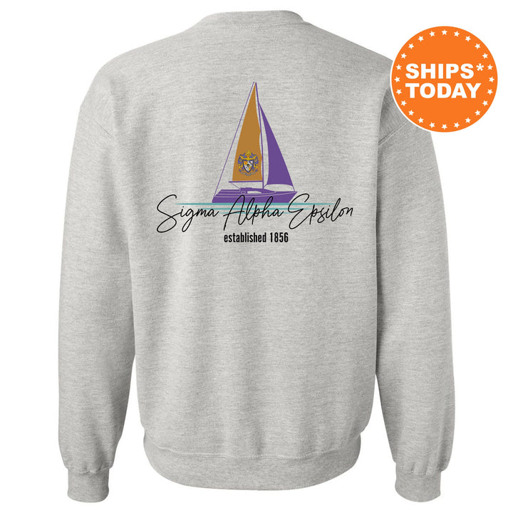 a sweatshirt with a sail boat on it