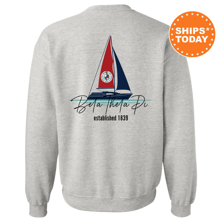 a sweatshirt with a sail boat on it