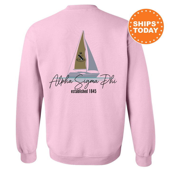 a pink sweatshirt with a sailboat on it