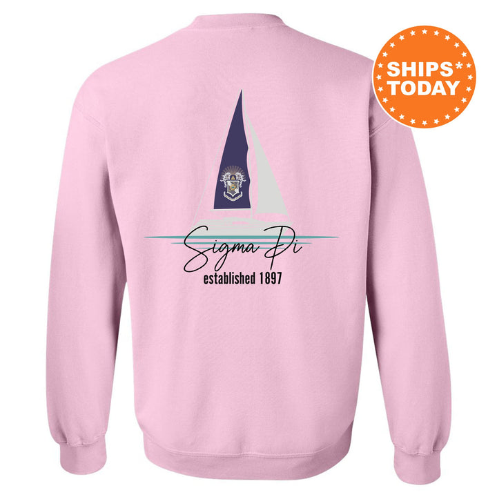 a pink sweatshirt with a sailboat on it