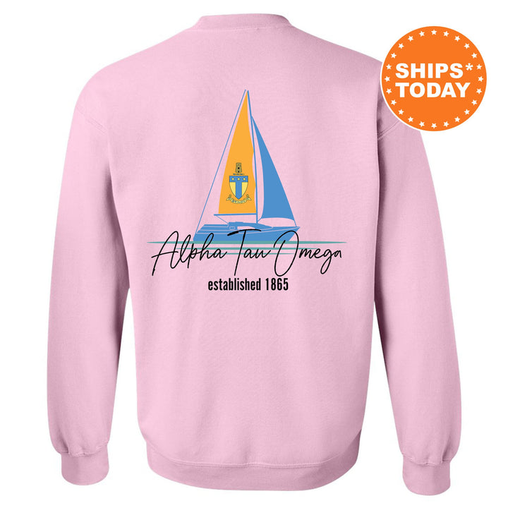 a pink sweatshirt with a sailboat on it