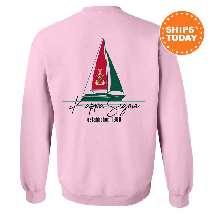 a pink sweatshirt with a sailboat on it