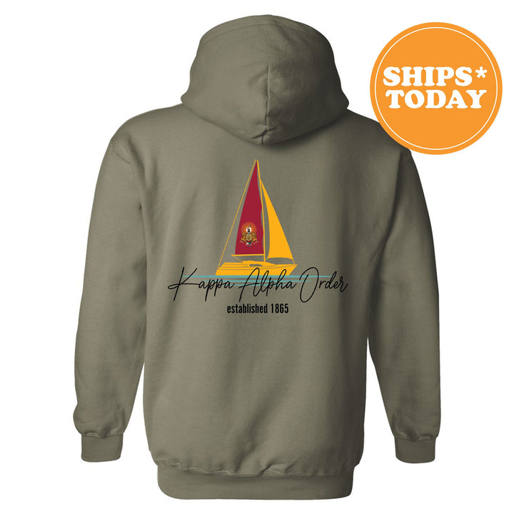 a gray hoodie with a sailboat on it