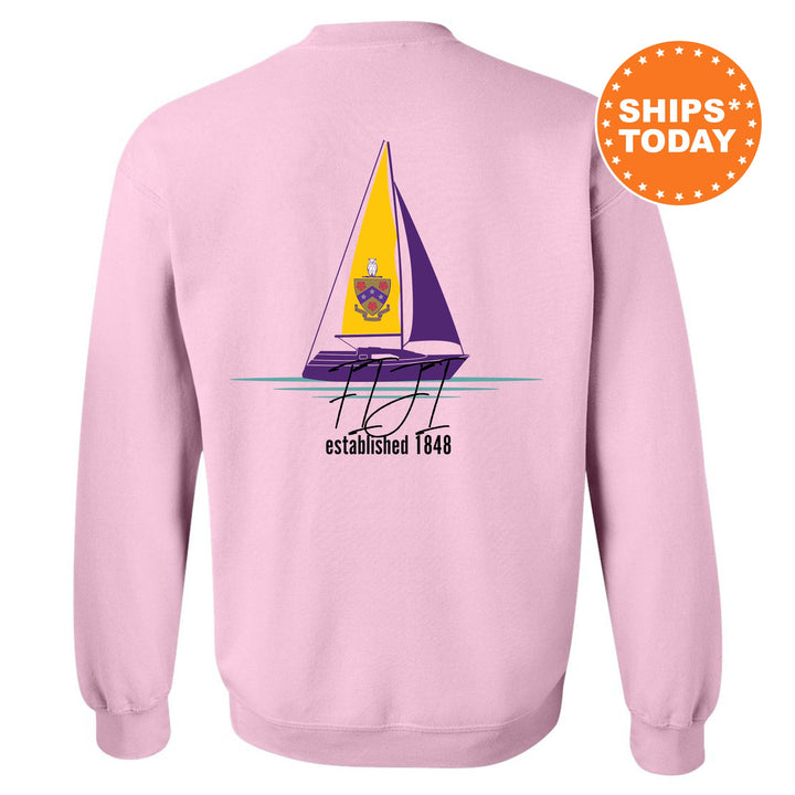 a pink sweatshirt with a sailboat on it