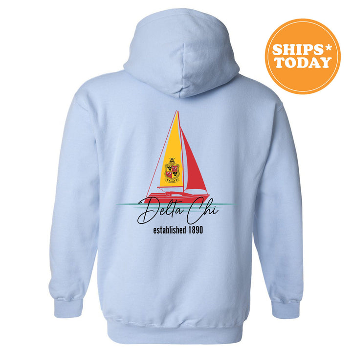 a light blue hoodie with a sailboat on it