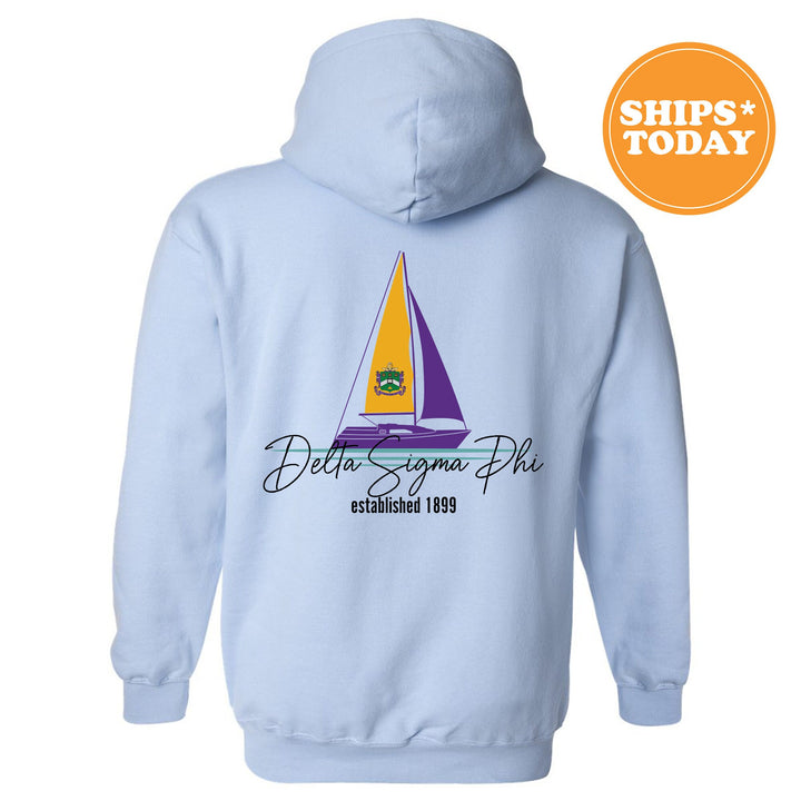 a blue hoodie with a sailboat on it