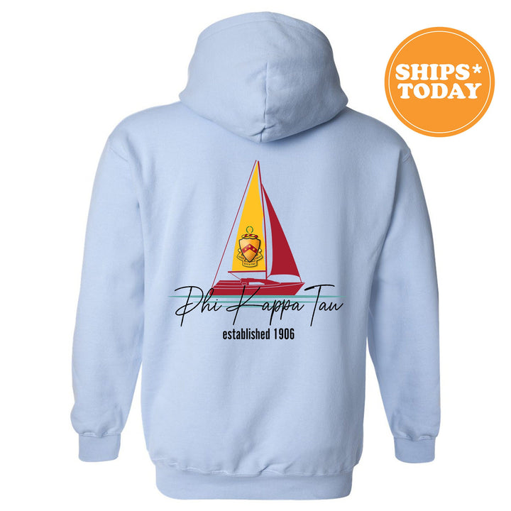 a blue hoodie with a sailboat on it