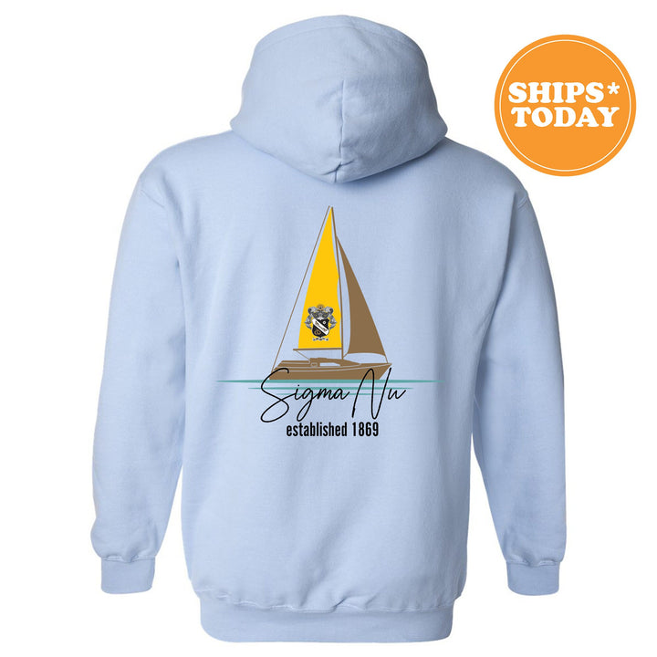 a light blue hoodie with a sailboat on it