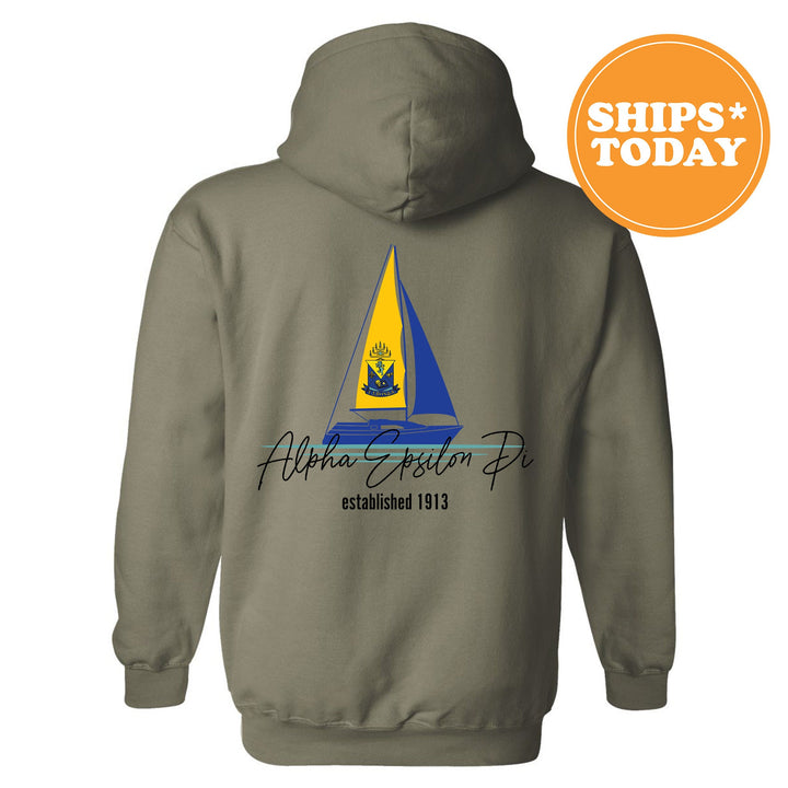 a gray hoodie with a sailboat on it
