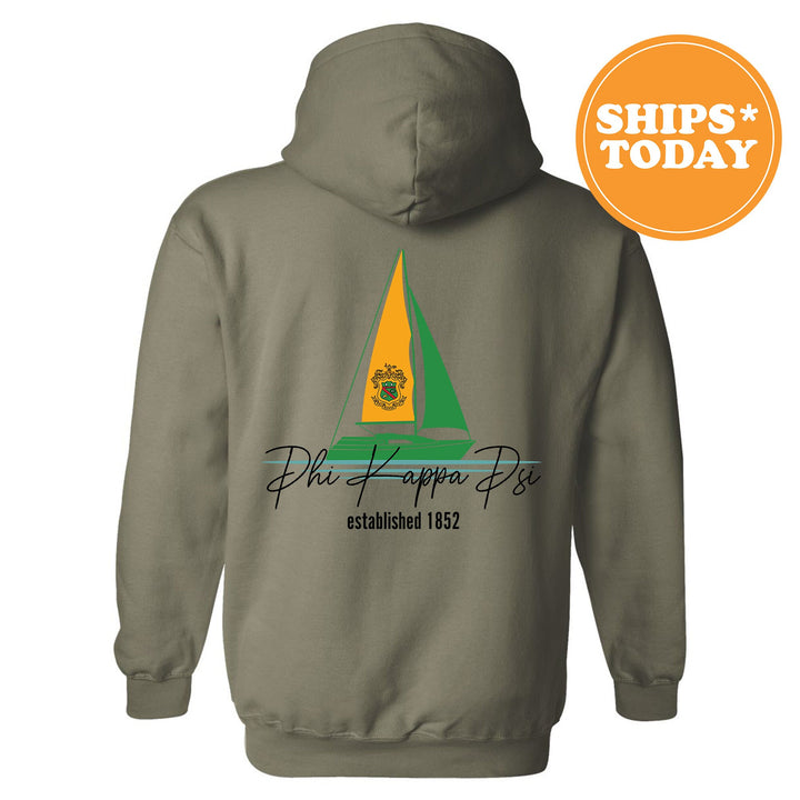 a gray hoodie with a yellow and green sailboat on it