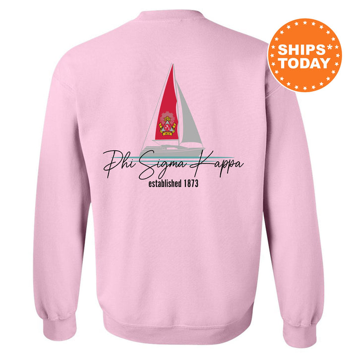 a pink sweatshirt with a sailboat on it