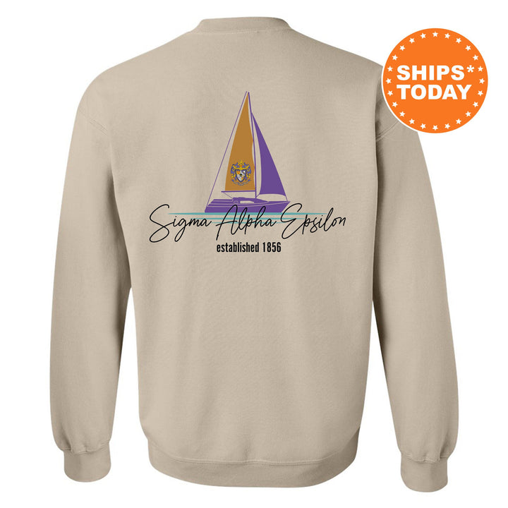a sweatshirt with a sail boat on it