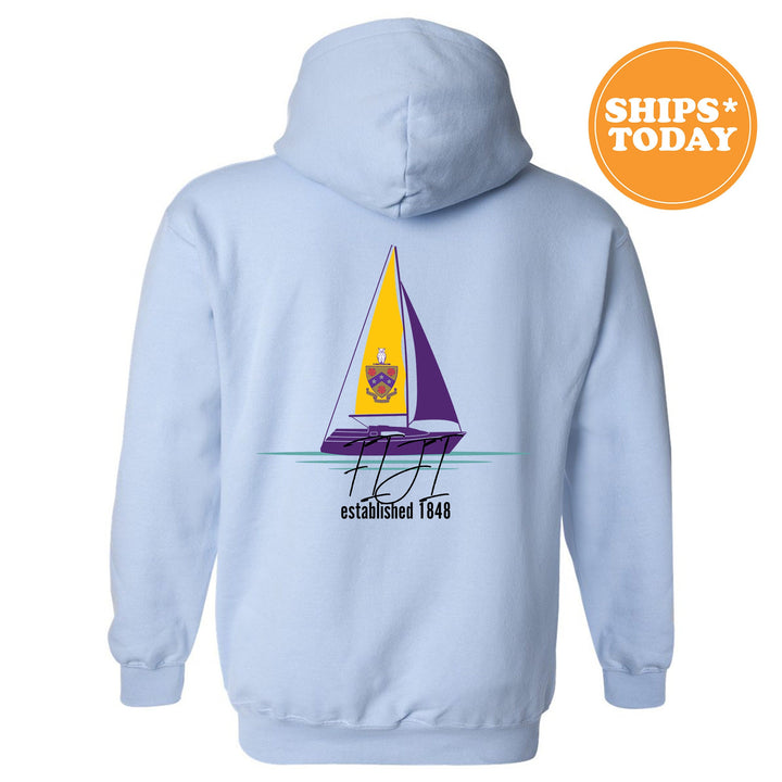 a blue hoodie with a sailboat on it