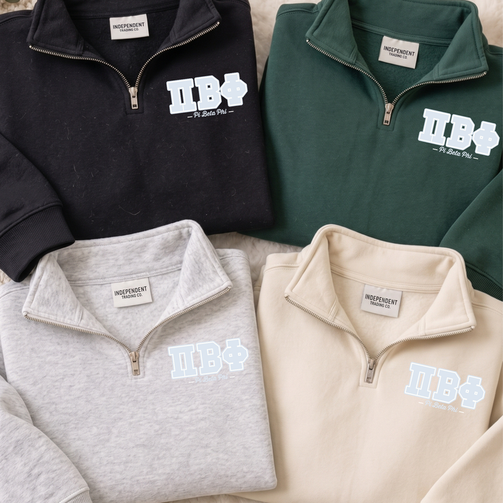 four different colored sweatshirts with the same logo on them, arranged in a row.