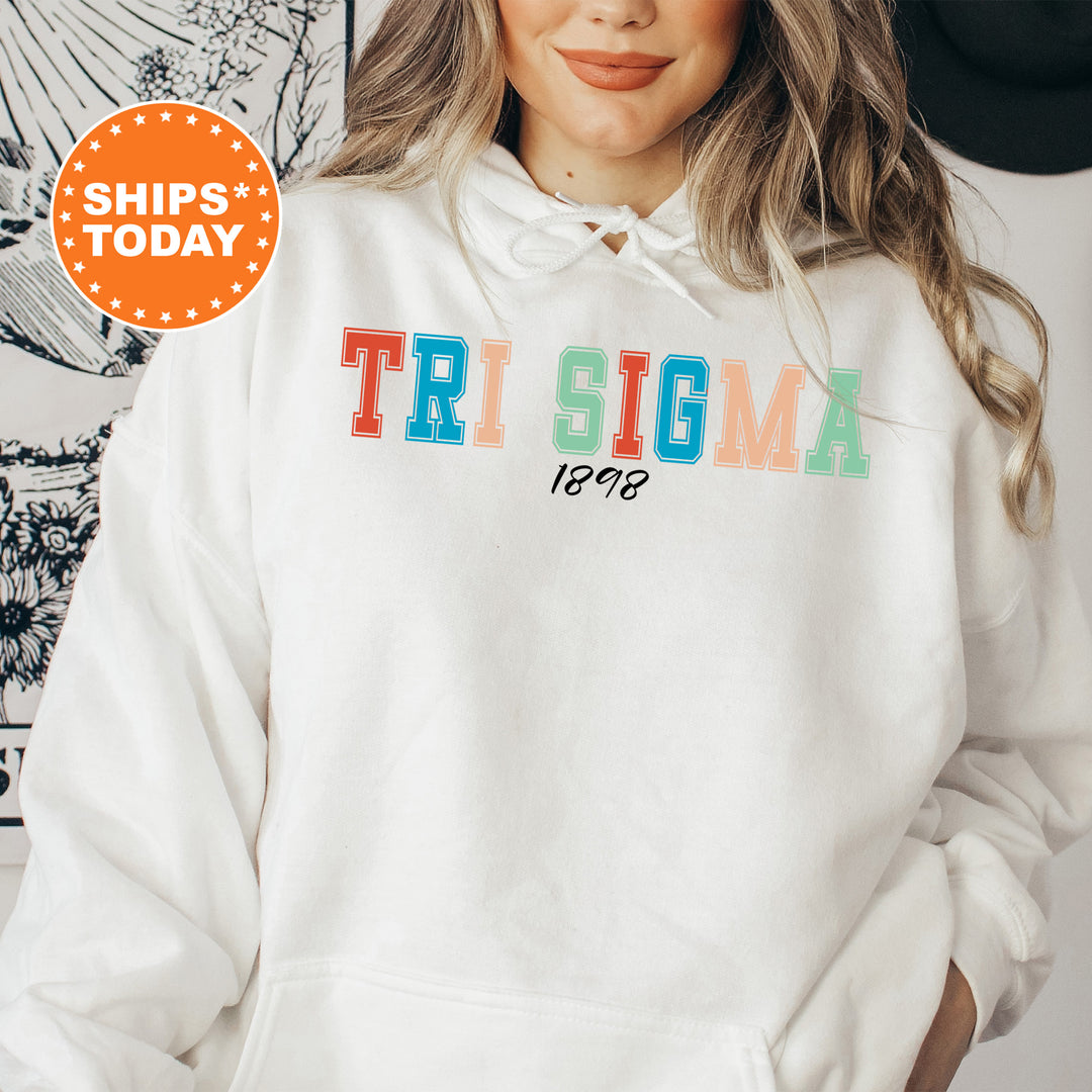 a woman wearing a white hoodie with the words tri stigma on it