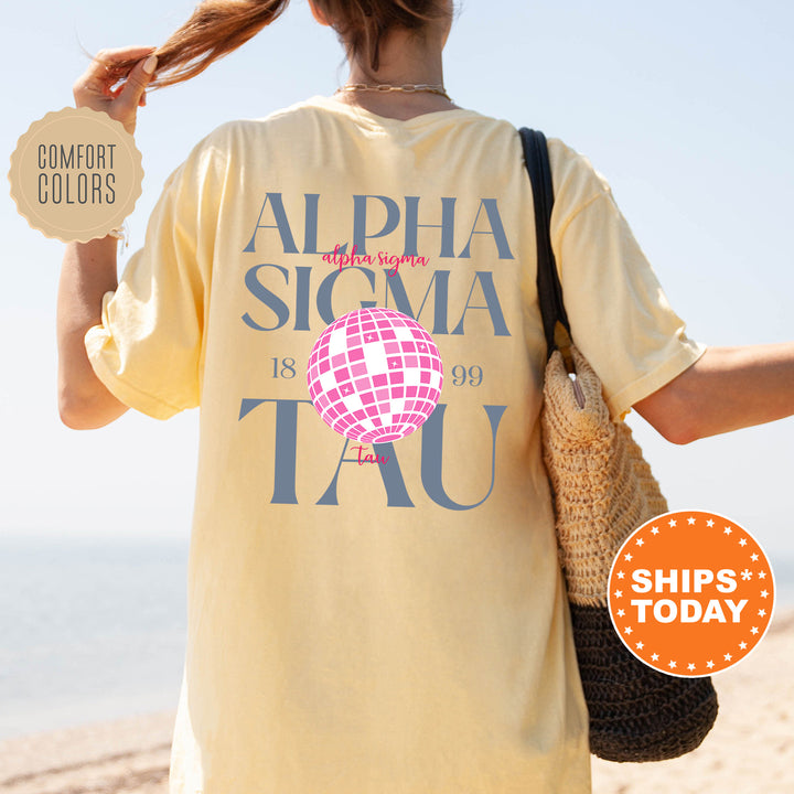 a woman walking on the beach with a t - shirt on