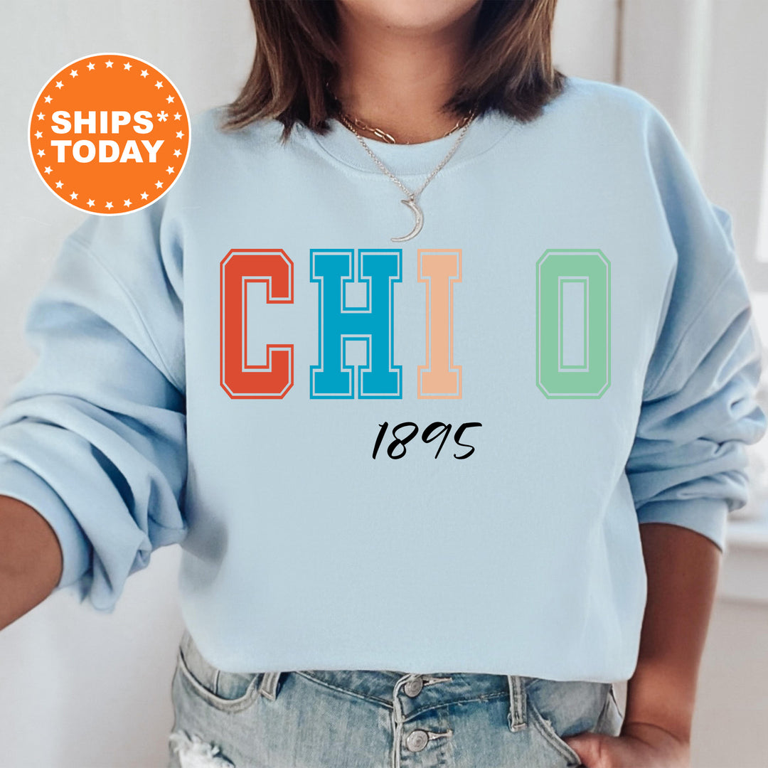 a woman wearing a blue sweatshirt with the word chio printed on it