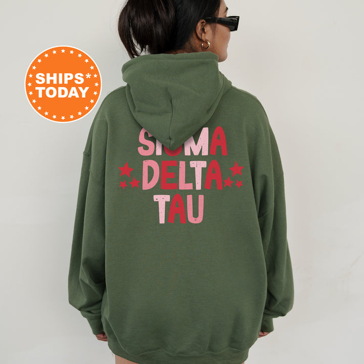 a woman wearing a green hoodie that says slima delta tau