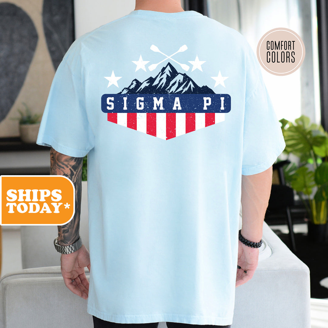 a man wearing a blue shirt with a red, white and blue design on it