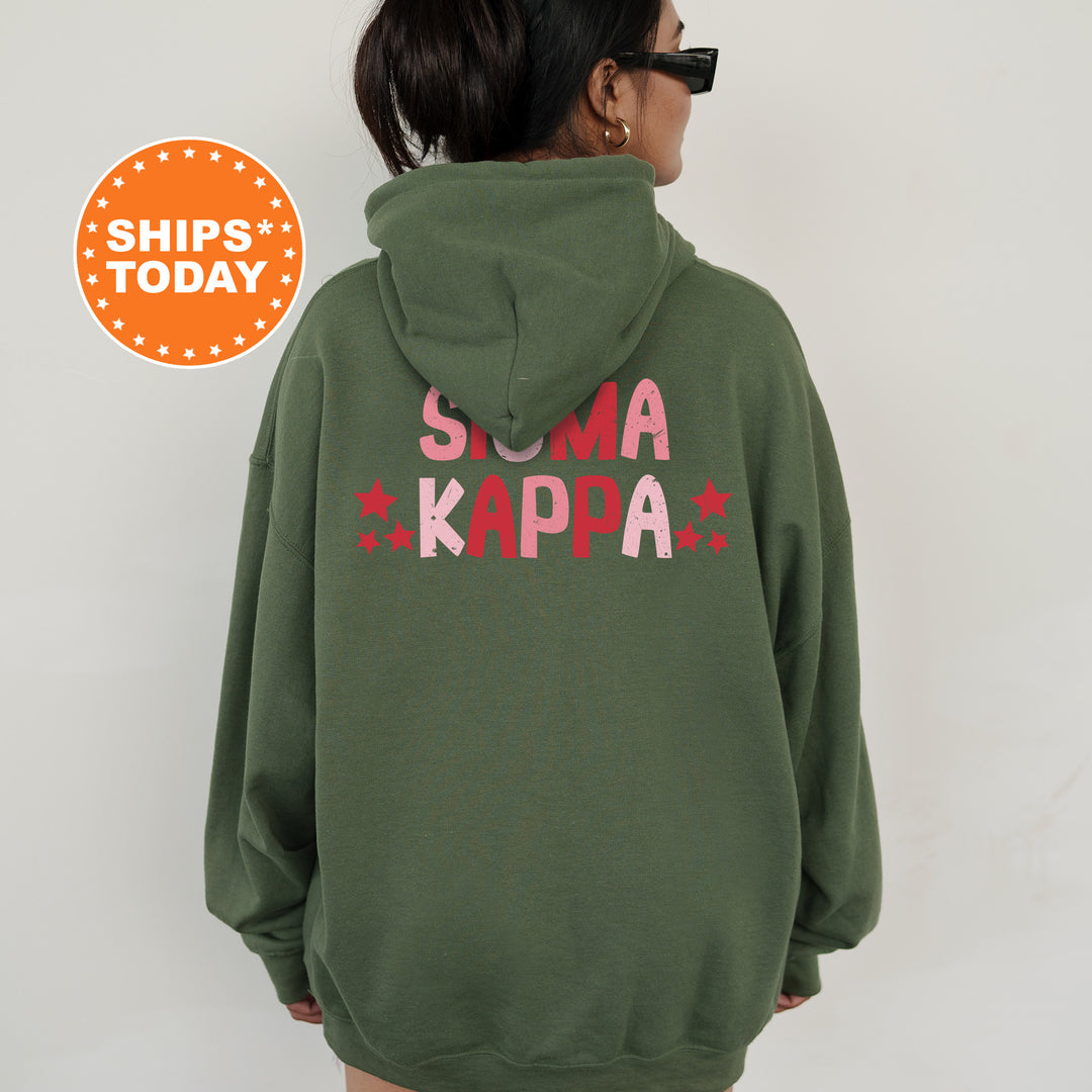 a woman wearing a green hoodie with the words suma kapa printed on