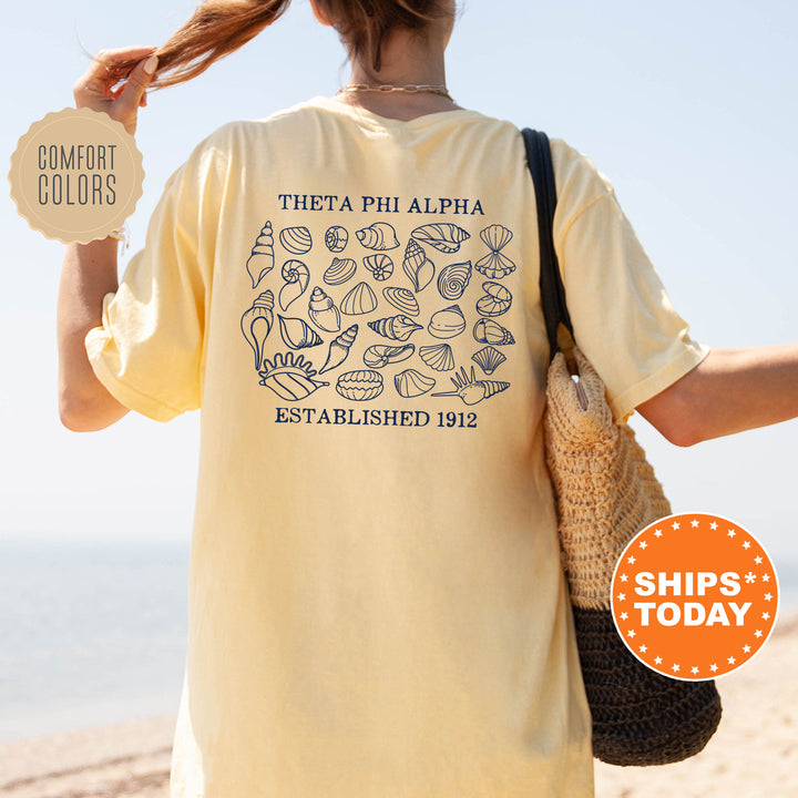 a woman with a yellow shirt is holding a brown bag