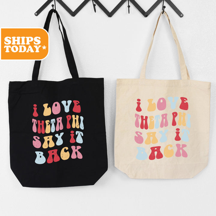two shopping bags hanging on a wall