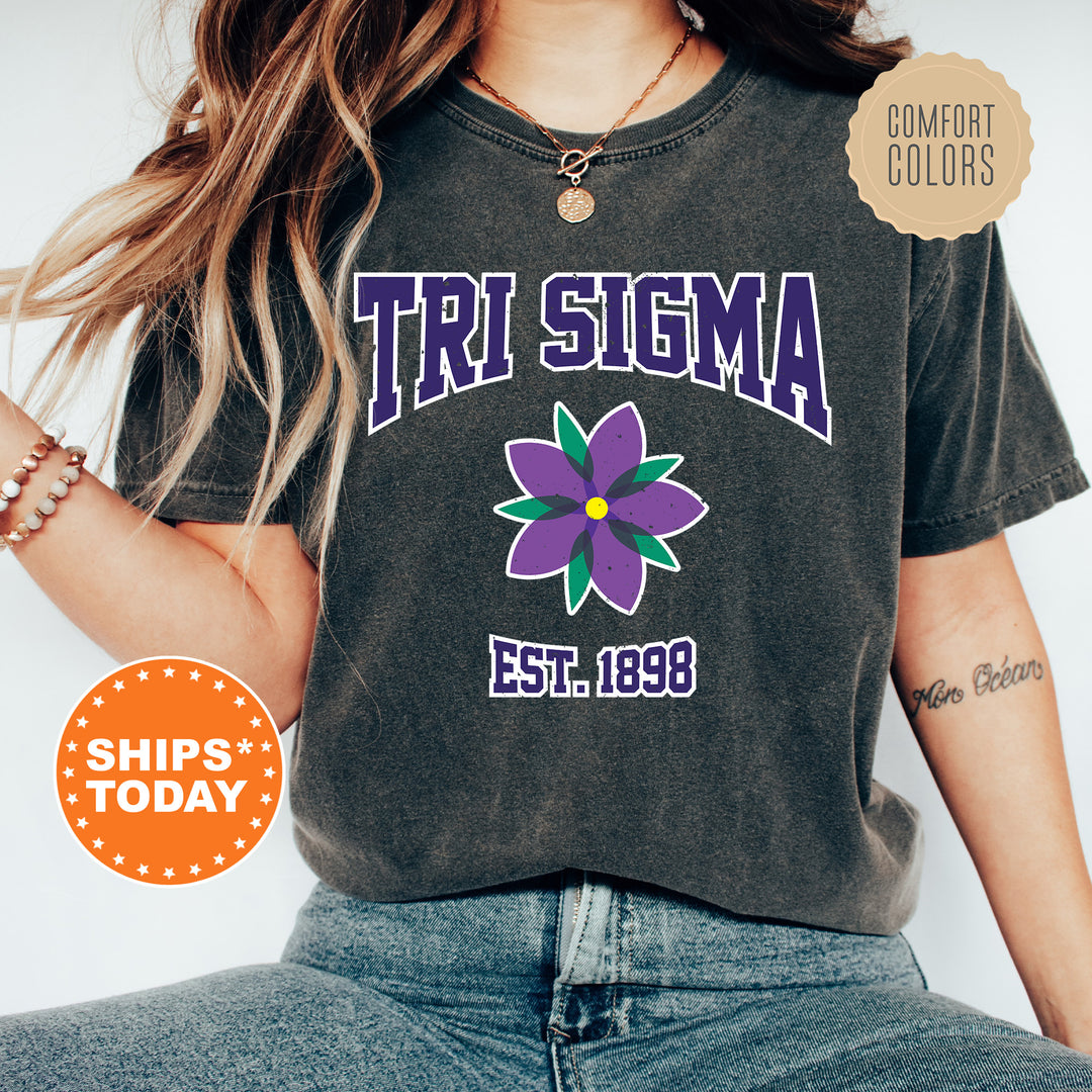 a woman wearing a t - shirt with a flower on it