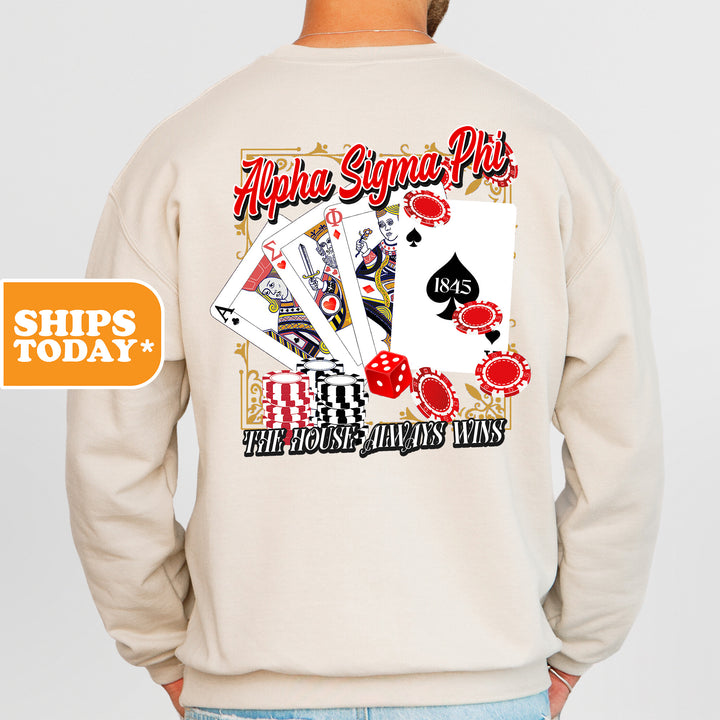 a man wearing a sweatshirt with a back print of playing cards