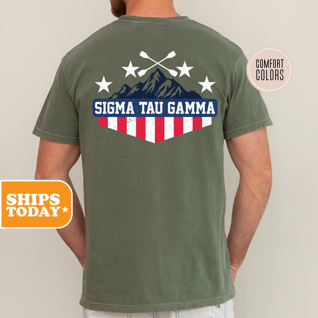a man wearing a green shirt with a flag and mountains on it