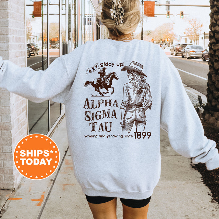 a woman walking down a sidewalk wearing a sweatshirt