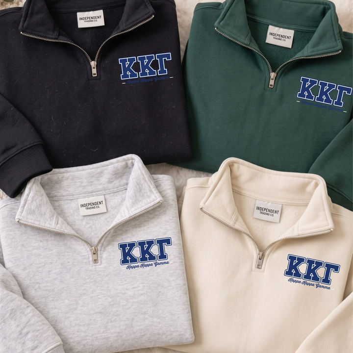 a collection of four sweatshirts, each with the letters "KKT" printed on them. The sweatshirts are arranged in a row, with one black, one green, one gray, and one beige.
